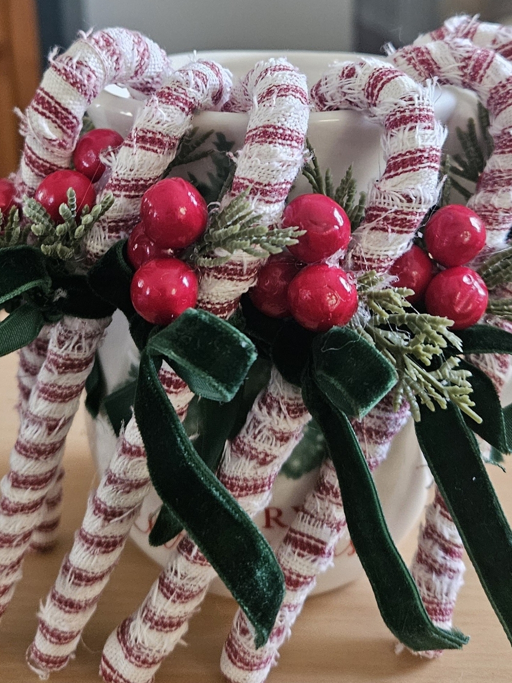 One Holiday Candy Cane Ornament with Red Berries and Green Velvet Bow